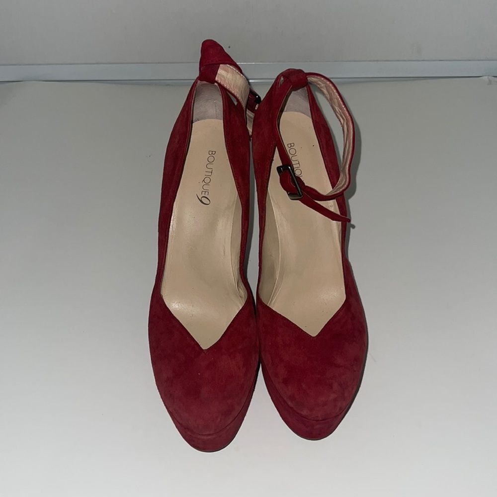 Red suede platform pumps with ankle strap